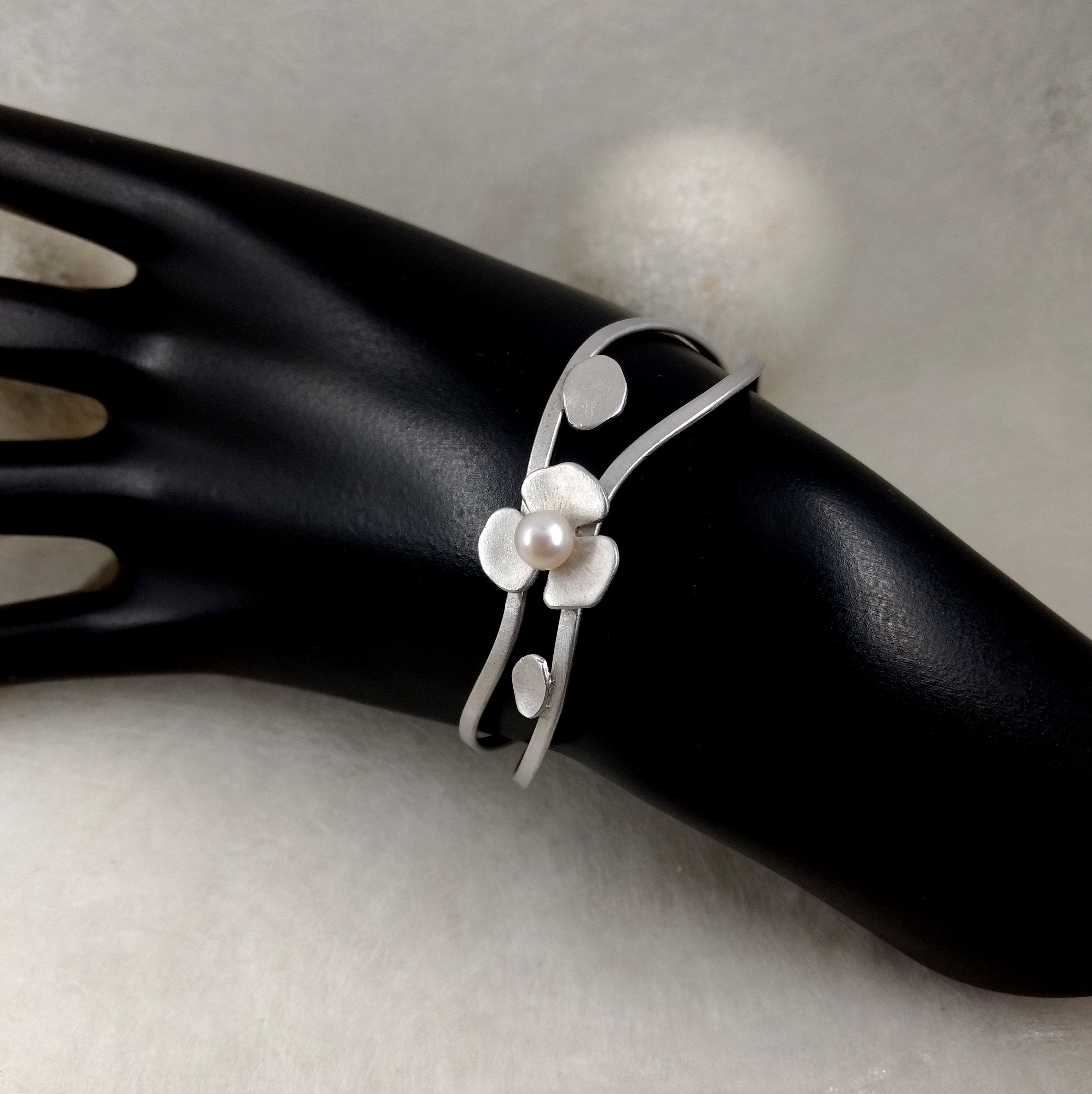 LoRe - open Sterling Silver bangle with white pearl, available in 2 finishes